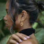 Modur earrings on model